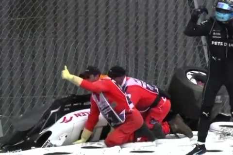 Watch heroic moment George Russell comes to aid of Zhou Guanyu after ditching Mercedes following horror British GP crash