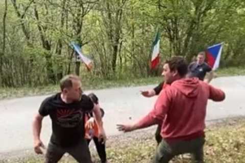 Terrifying moment race steward is ‘seconds from tragedy’ as rally car flies through air past him after breaking up fight