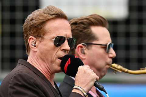 F1 fans absolutely baffled as Hollywood star sings national anthem ‘like Elvis’ alongside a saxophonist at Silverstone