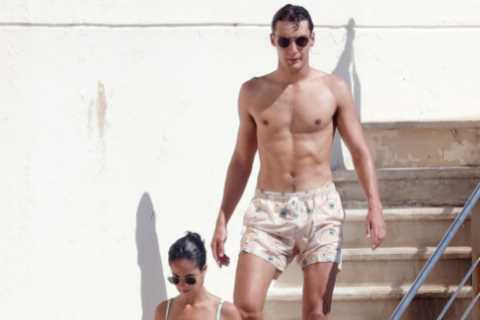 Ripped F1 star George Russell and stunning girlfriend Carmen Montero Mundt enjoy smooch in sea on paddle board holiday
